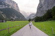 © ADDICTIVE STOCK - Young woman walking on a scenic path in Lauterbrunnen, Switzerland