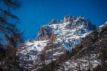 Dolomites in winter. Val Fiscalina, between peaks, larch forests, mountain pines and warm huts.