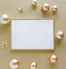 Wall Mural - Gold frame blank mockup with copy space top view and gold Christmas decoration on golden background . Xmas background