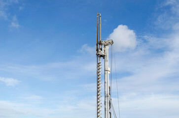 Wall Mural - Building activity on contruction site.Drilling machine.Wind turbine construction.