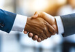 © Yevheniia - A close-up of two hands shaking, symbolizing trust, partnership, and agreement. The blurred background emphasizes the gesture, ideal for business or corporate visuals.