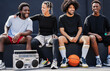 © DisobeyArt - Group of young multiracial people listening music from vintage boombox stereo outdoor after basketball match - Sport, friendship and urban lifestyle concept - Focus on faces