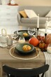 © New Africa - Stylish table setting with beautiful autumn decor in dining room
