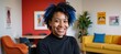 © Pixel Matrix - African American female wheelchair-bound lesbian co-worker with bold blue hair works in vibrant and inclusive office space depicted authentically through a candid portrait