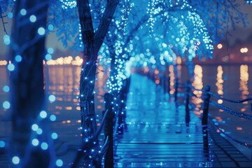 Aufkleber - A walkway with blue lights at night next to a calm body of water