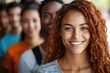 © Gatherina - Young latin woman smiling with diverse group of students in background
