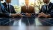© Oulaphone - A group of professionals in suits engaging in a business discussion at a table with solar panels, set against a modern urban backdrop.