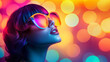 © LarisaM - A woman with purple hair and sunglasses is looking up at the camera