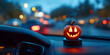 © Repunzel - Glowing pumpkin on car dashboard, creating warm and festive Halloween atmosphere. 4k high quality image