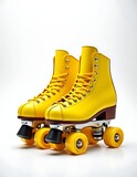 A pair of yellow roller skates on white background, sports concept