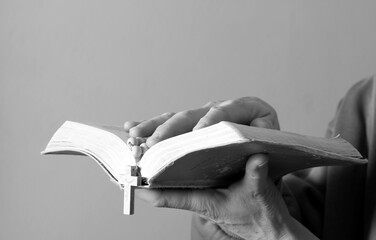 praying to god with hands together on grey background with people stock photo stock image	