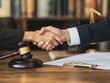 © Helen-HD - A lawyer and client celebrate a successful legal consultation with a handshake in a well-organized office filled with law books and documents
