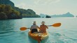 © Nicat - A retired couple paddling a kayak at Angthong Marine Park in Thailand, symbolizing active elderly lifestyles.