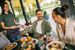© Mediteraneo - People paying with contactless credit card in a restaurant.
