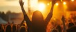 © Ytnart - A vibrant scene capturing the energy of a concert with an audience celebrating under a sunset glow.