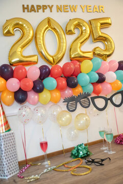 Generative AI Celebration New Year 2025 with a Halloween twist, featuring decorated pumpkins, gift spooky vibes, beautiful and realistic balloon decorations, aesthetic, and elegant 2025 number      