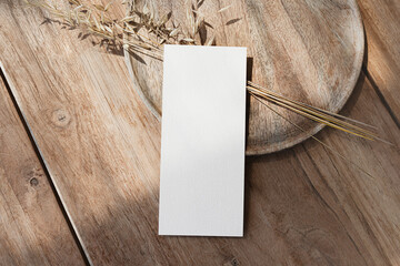 4x9 blank menu card mock up on wooden table