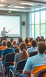© IBEX.Media - Business seminar with a diverse audience listening to a speaker in a modern, sunlit conference room. The image is blurred for emphasis on the setting