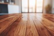 © Chawakorn - Closeup of a wooden table top in a modern kitchen with a blurred background.