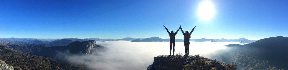 Wall Mural - two people on top of the mountain with their arms raised in victory, overlooking beautiful mountains and a foggy valley below Generative AI