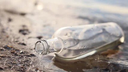 Wall Mural - bottle floating on water. glass and plastic bottle pollutes the river, the concept of recycling garb