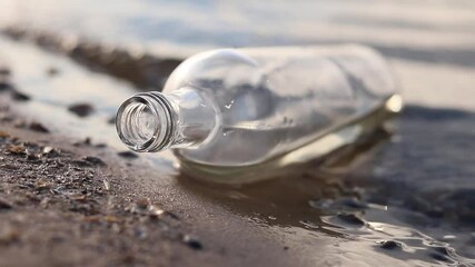 Wall Mural - bottle floating on water. glass and plastic bottle pollutes the river, the concept of recycling garb