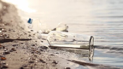 Wall Mural - bottle floating on water. glass and plastic bottle pollutes the river, the concept of recycling garb