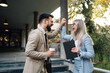 © Zamrznuti tonovi - Two excited business people celebrating success outdoors