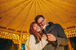 © Zamrznuti tonovi - Festive couple is celebrating new year's eve on street with sparklers.