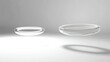 © InspirationDesign - Floating white rings with shadows