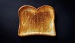 © Konstantin - toast bread on black table top flat view , Homemade Warm Buttered Toast for breakfast