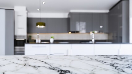 Close up of marble kitchen countertop with blurry background of modern kitchen with gray and white cabinets.