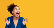 © Prostock-studio - So Happy. Overjoyed black girl screaming isolated over yellow studio wall, looking away, copyspace