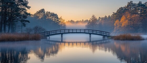 Poster - Wooden Bridge Reflecting in a Foggy Lake at Sunrise