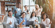 © Prostock-studio - Cheerful young multiethnic business team posing together in office, showing thumbs up