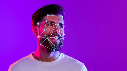 A smiling young man displays a digital overlay of facial recognition technology on his face. The vibrant purple background enhances the futuristic theme of the moment.