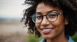 © VistaVisions - Headshot portrait of happy mixed race african american black girl wearing glasses