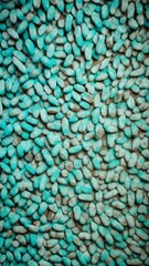 Poster - Turquoise pebbles forming a dense, textured pattern, evoking a natural and earthy feel