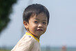 © alenthien - Happy asian toddler smiling outdoors in a park