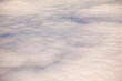 © Mint Images - Mid Air view of cloud cover from an aircraft over the  Pacific Ocean.