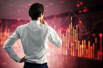 Poster - Back view of pensive young european man with falling red candlestick forex chart on blurry office background. Crisis and market recession concept. Double exposure.