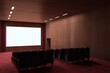 © Who is Danny - Modern red carpet wooden cinema hall with empty white mock up place on screen. 3D Rendering.