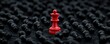 © Wimon - Conceptual art showing a red king chess piece ahead of black pawns, representing leadership, courage, and standing out from the crowd.