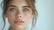 © visoot - Portrait of a young woman with clear, beautiful skin and no makeup, set against a white background.