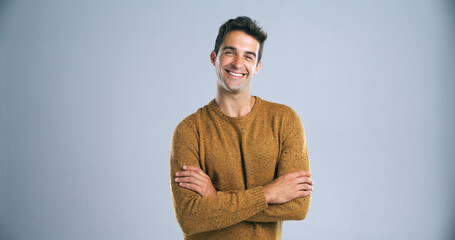 Fototapete - Studio, happy and man with portrait for arms crossed, positive attitude and ambition by backdrop. Gray background, male person and teacher with confidence for career, knowledge and mockup space