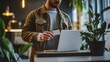 © Chatchanan - A focused man standing at a modern desk, holding a card