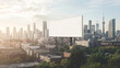 © AspctStyle - Large blank billboard mockup set against an urban skyline, perfect for showcasing advertising designs, branding, or promotional content in a modern city environment.