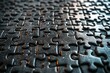 © Outkast - Close-up of Interlocking Black Puzzle Pieces