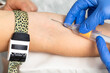 © Dmitry Naumov - Nurse taking a blood sample from a patients arm