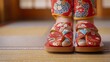 © BanklangArtshop - Traditional Japanese footwear on a tatami mat in a serene home environment.